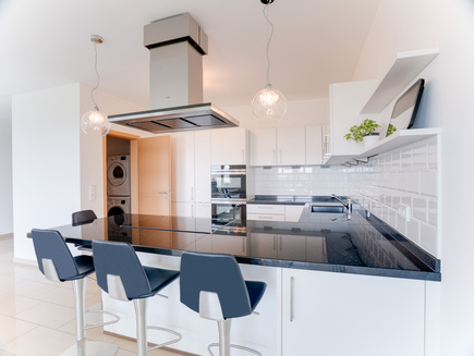 Kitchen view with open pantry door